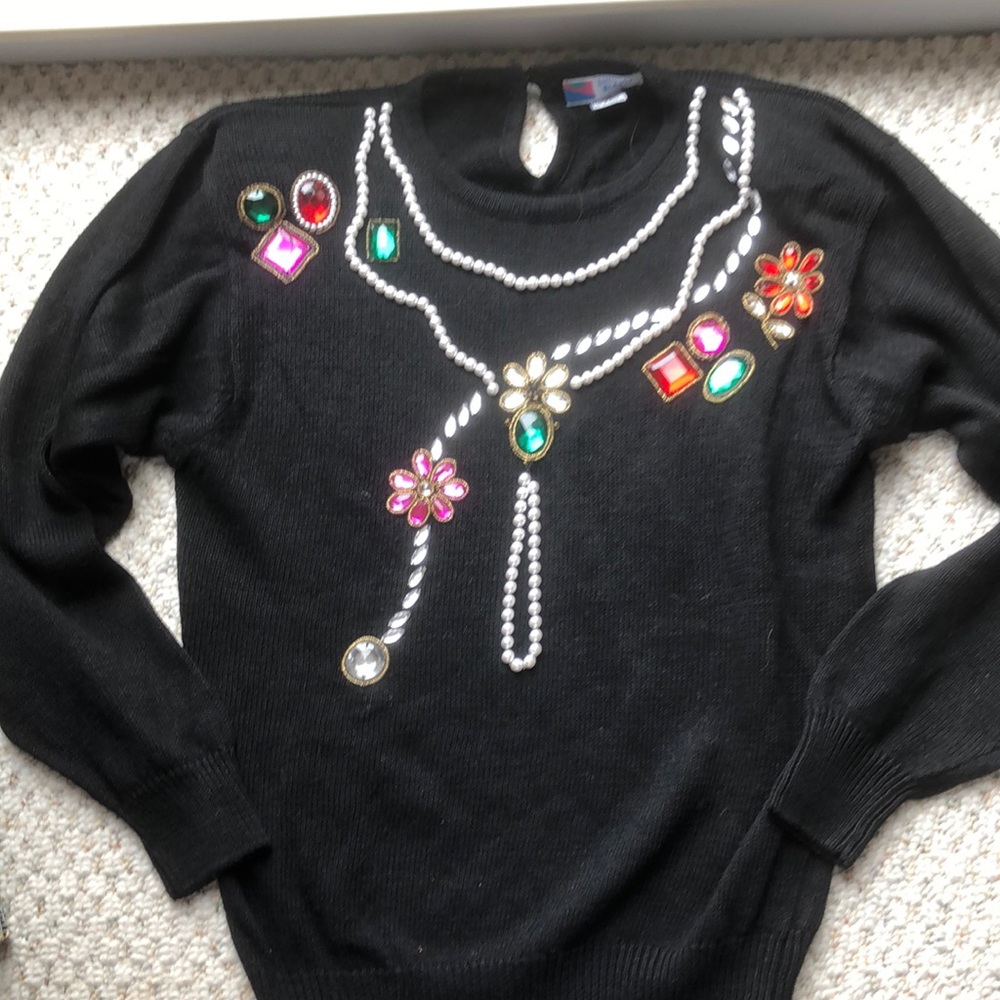- Beads and pearls decorated black sweater size large